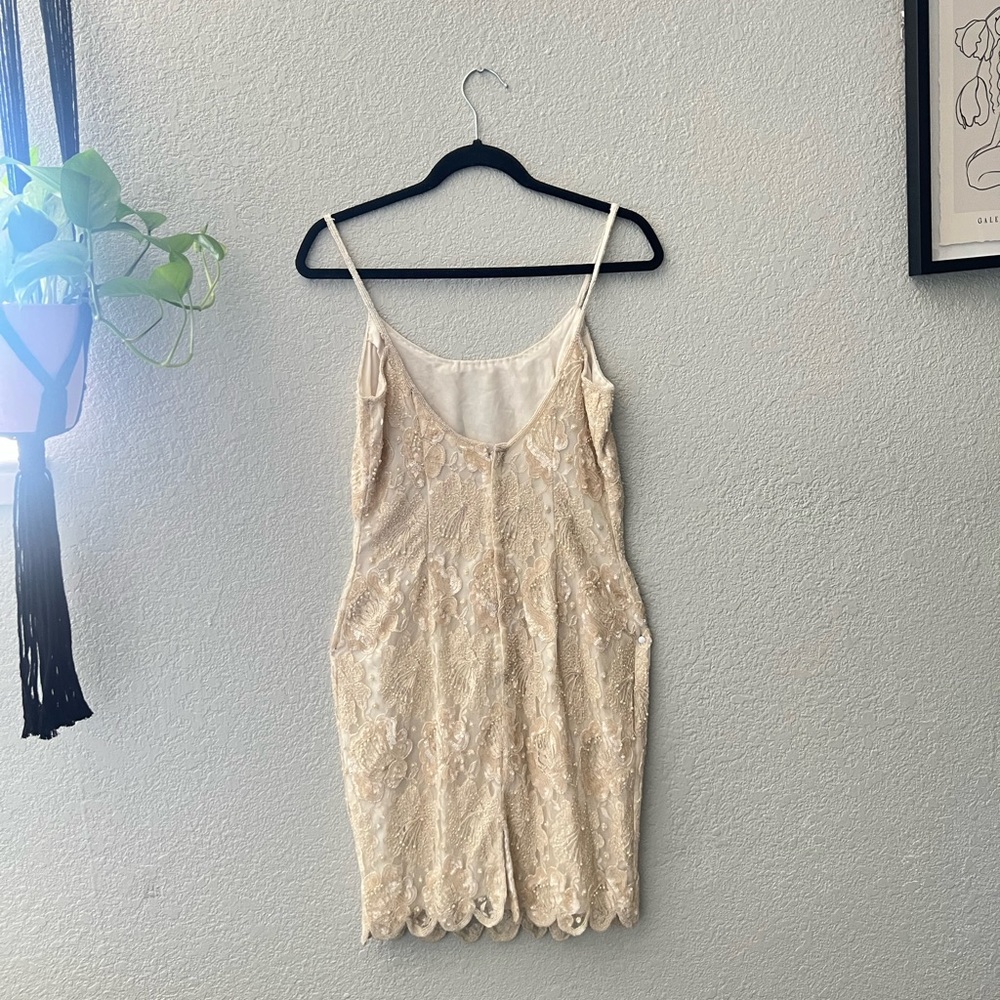 Vintage white lace dress with pearls fits, small or medium has a slit in the bag